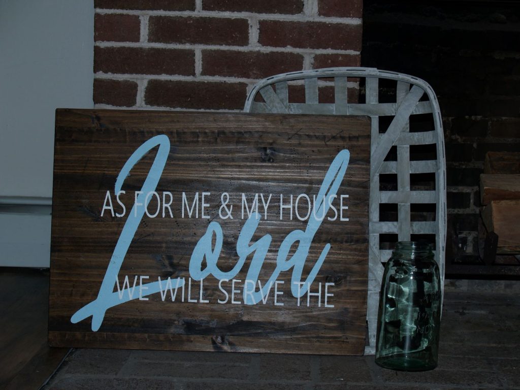 board painted with biblical quote